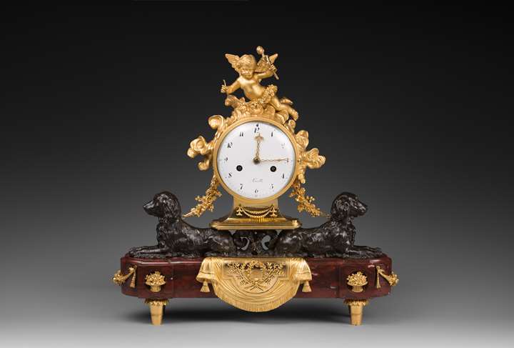 Louis XVI patinated and gilded bronze clock